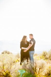 husband and wife hold each other during golden hour in east wenatchee