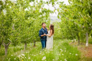 man and wife dancing in cashmere family orchard