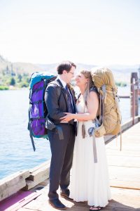 adventure elopement couple embracing on lake chelan dock